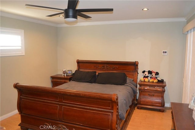 bedroom with ceiling fan, light hardwood / wood-style flooring, and crown molding