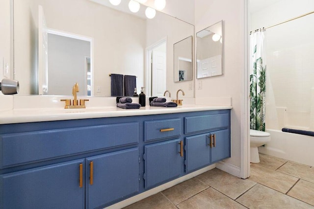 full bathroom featuring toilet, vanity, tile patterned floors, and shower / bath combo