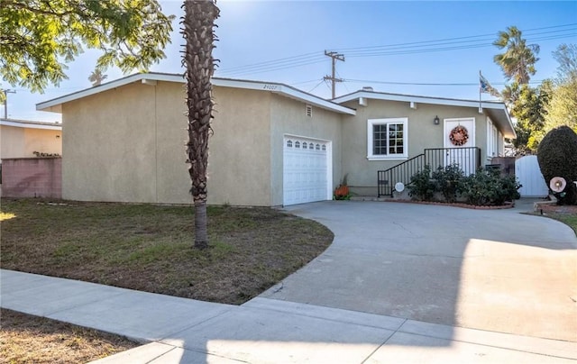 single story home with a garage