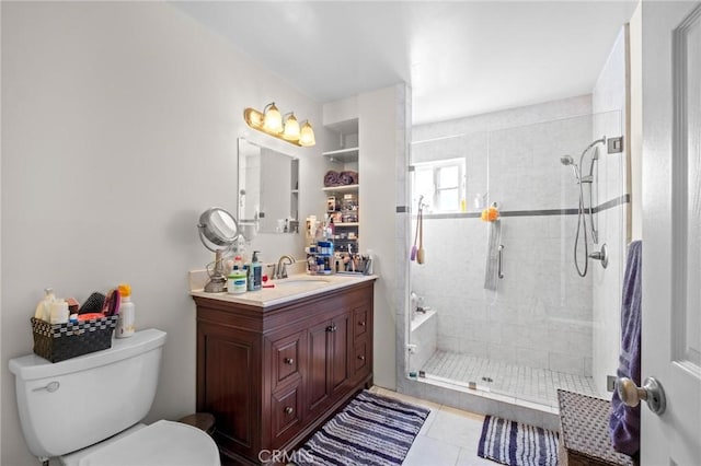 bathroom with tile patterned flooring, vanity, toilet, and an enclosed shower