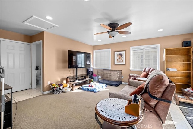 carpeted living room with ceiling fan