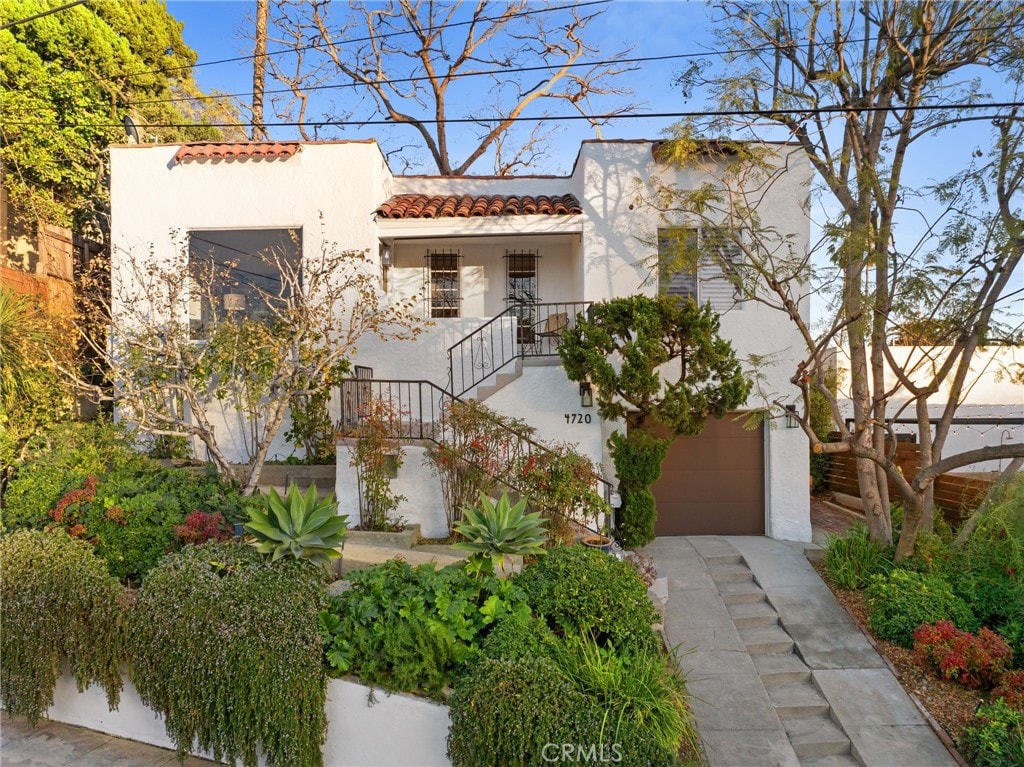 mediterranean / spanish house featuring a garage