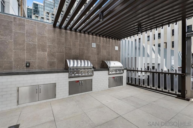 view of patio / terrace with an outdoor kitchen and area for grilling