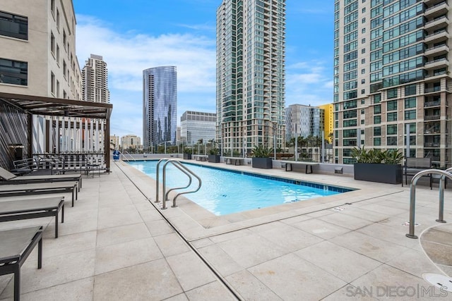 view of swimming pool with a patio area