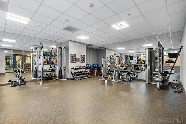 gym featuring a paneled ceiling