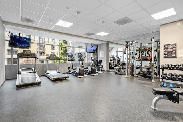 workout area with a paneled ceiling