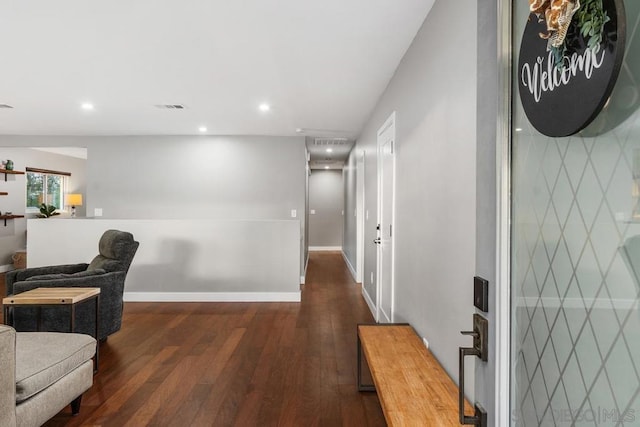 corridor featuring dark hardwood / wood-style flooring