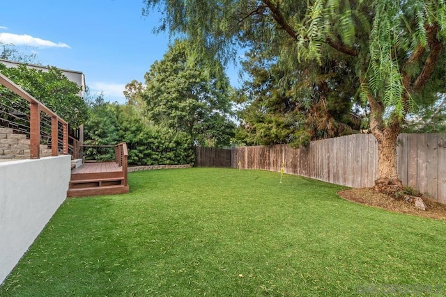 view of yard with a wooden deck