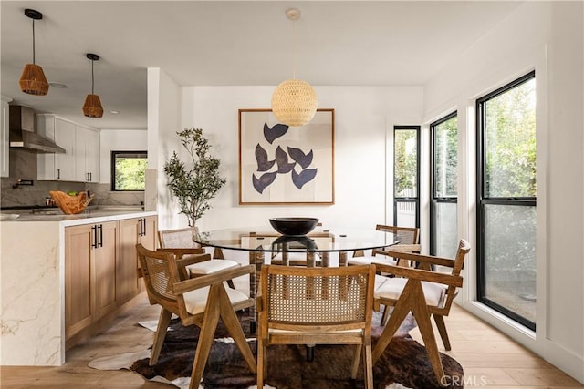 dining area featuring light wood-type flooring