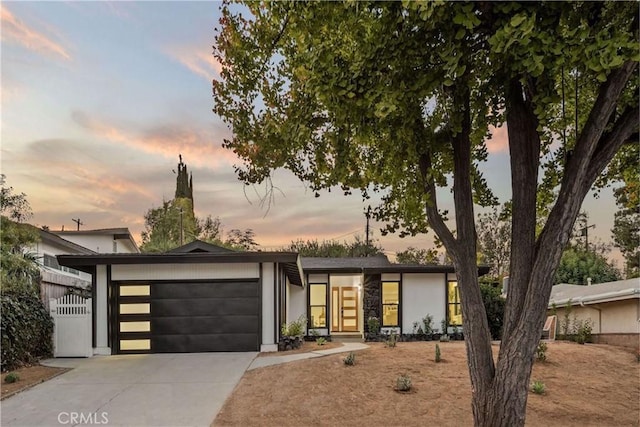 view of front of property with a garage