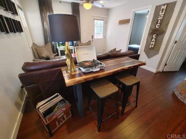 interior space with ceiling fan and dark wood-type flooring