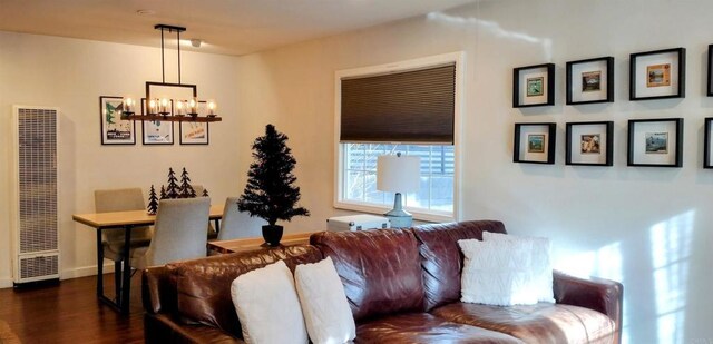 living room featuring dark hardwood / wood-style floors and a chandelier