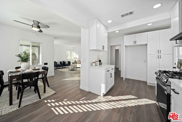 kitchen featuring white cabinets, dark hardwood / wood-style flooring, and black range with gas stovetop