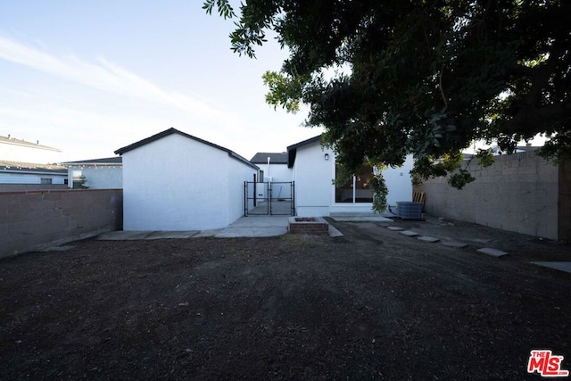 rear view of house with central AC