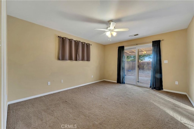 spare room with ceiling fan and carpet flooring