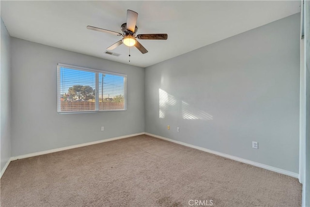 empty room with carpet and ceiling fan