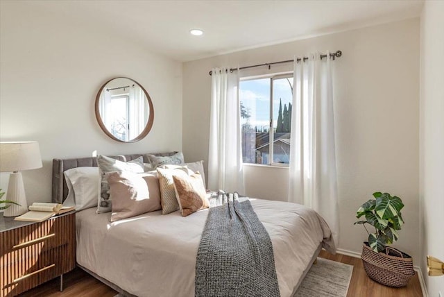 bedroom with hardwood / wood-style floors