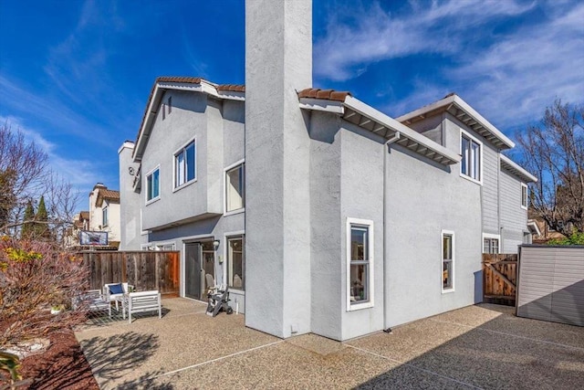 back of house featuring a patio area