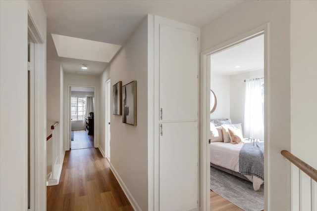 hallway featuring wood-type flooring