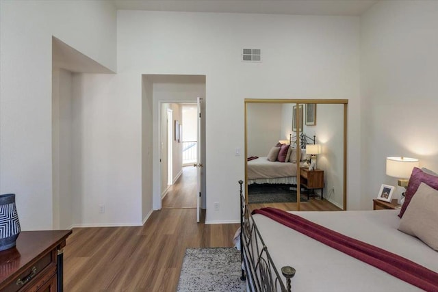 bedroom featuring a closet and hardwood / wood-style flooring