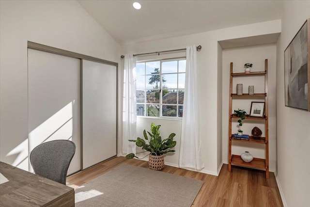 office area with lofted ceiling and light hardwood / wood-style floors