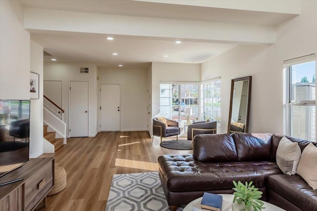 living room with light hardwood / wood-style flooring