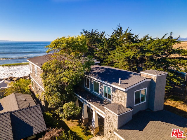 drone / aerial view featuring a view of the beach and a water view