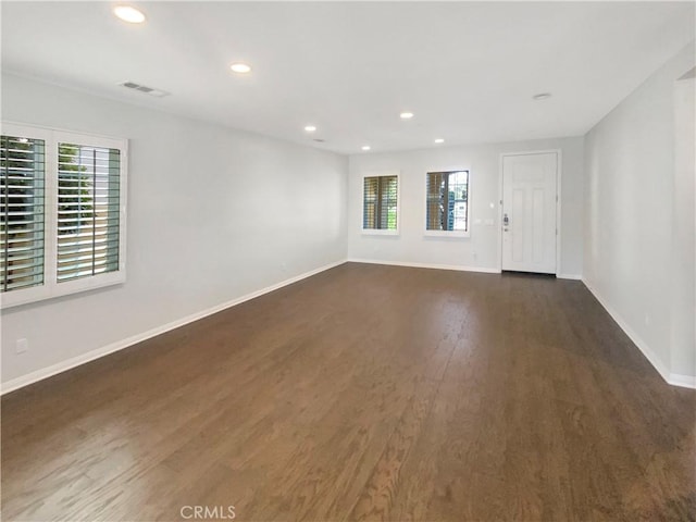 unfurnished room with dark hardwood / wood-style floors