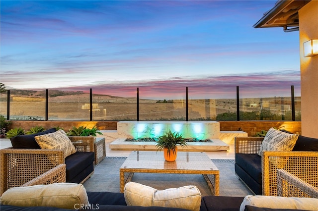 patio terrace at dusk with an outdoor living space