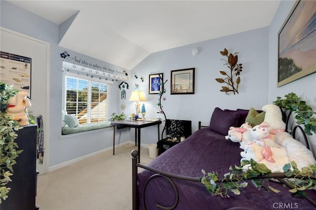 carpeted bedroom featuring lofted ceiling