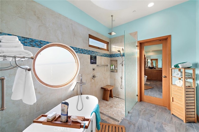 bathroom featuring a tile shower and tile walls