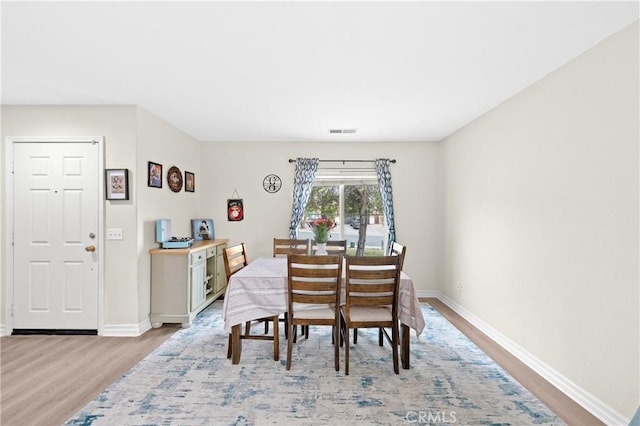 dining room featuring light wood-type flooring