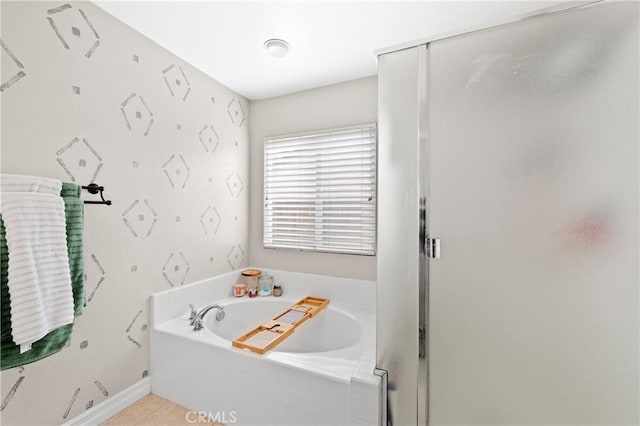 bathroom with tile patterned floors and independent shower and bath