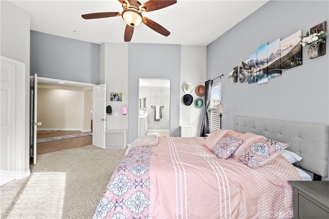 carpeted bedroom featuring ceiling fan and connected bathroom