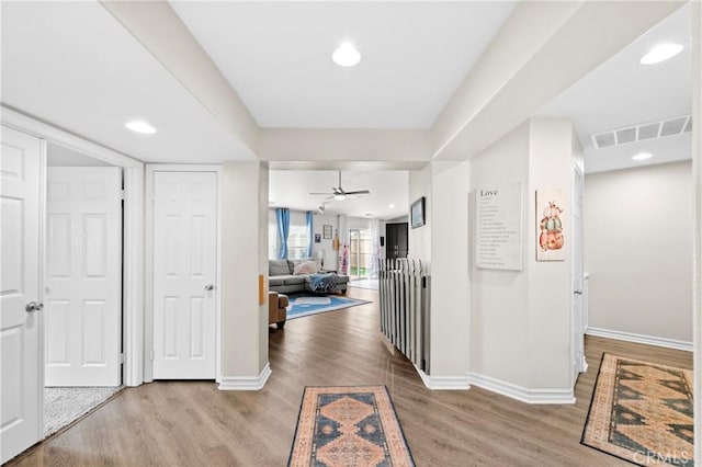 hall with light hardwood / wood-style flooring