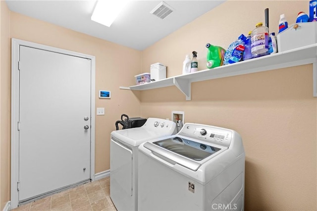 laundry area featuring washing machine and clothes dryer