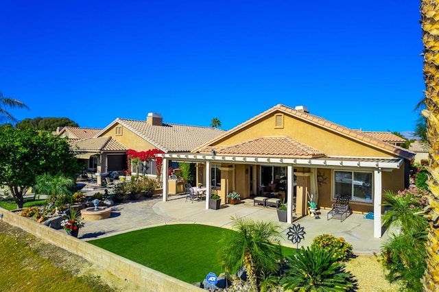 rear view of property with a patio area