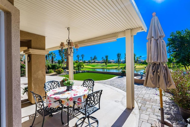 view of patio with a water view