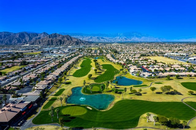 birds eye view of property with a mountain view