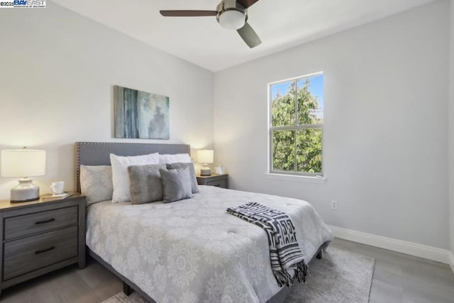 bedroom featuring ceiling fan and wood-type flooring