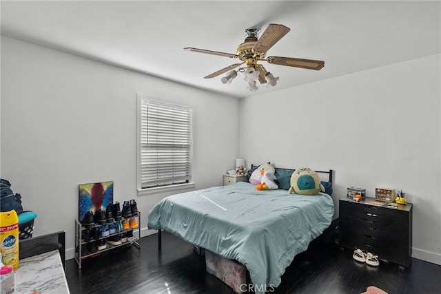 bedroom featuring dark wood-type flooring and ceiling fan