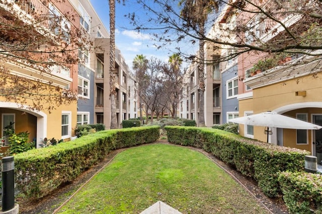 view of home's community featuring a lawn