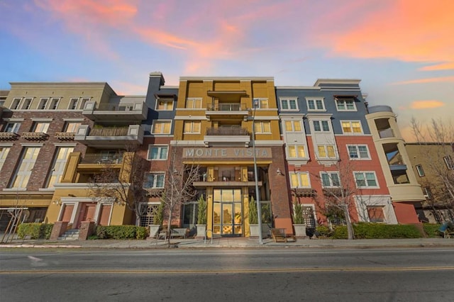 view of outdoor building at dusk