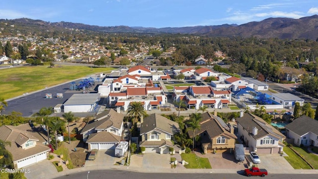 birds eye view of property featuring a mountain view