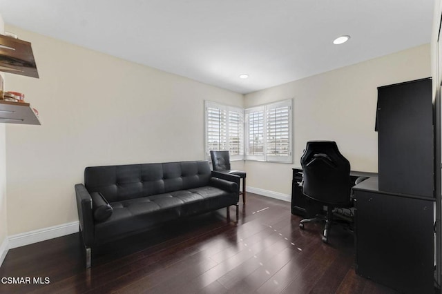 home office with dark hardwood / wood-style flooring