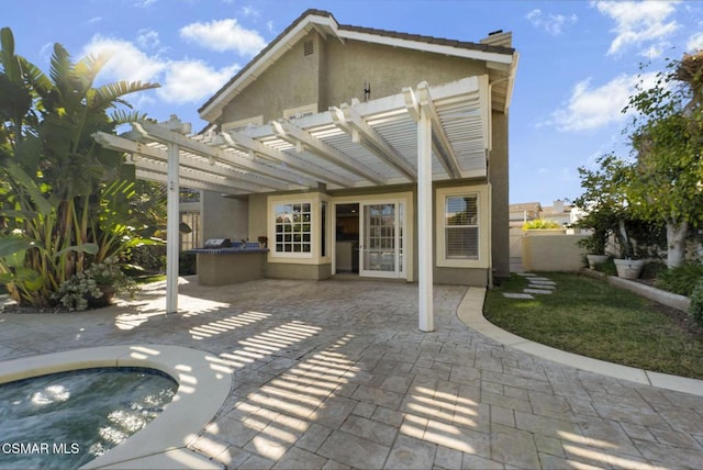 back of house featuring a pergola and a patio area