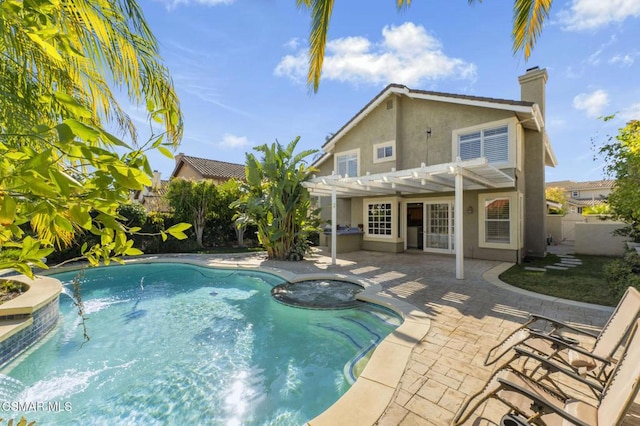 view of pool featuring a pergola, a patio area, and an in ground hot tub