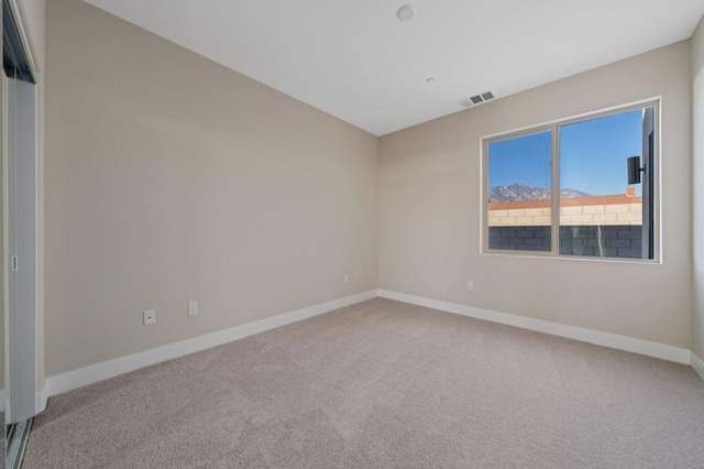 unfurnished room with carpet flooring