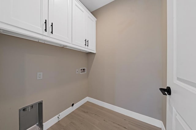 washroom featuring hookup for a gas dryer, light wood-type flooring, washer hookup, and cabinets