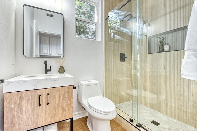 full bath featuring a stall shower, visible vents, vanity, and toilet